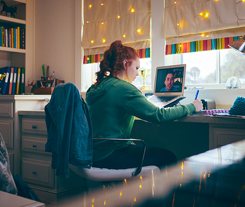 girl in virtual class with teacher