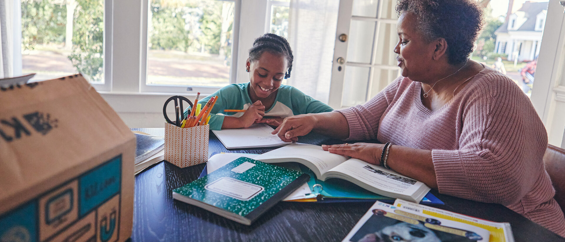 Mother and son doing homework at home