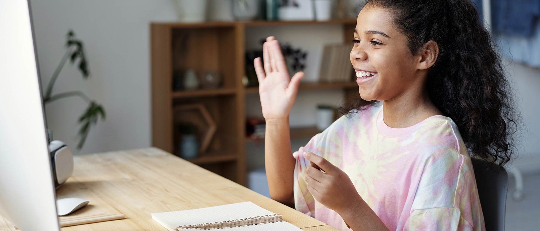 Girl waiving her hand